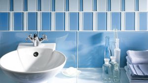 Bathroom blue glass tile backsplash installation